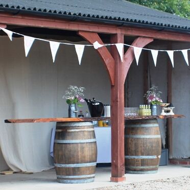 Rustic Tree Trunk Bar and 2 Barrels